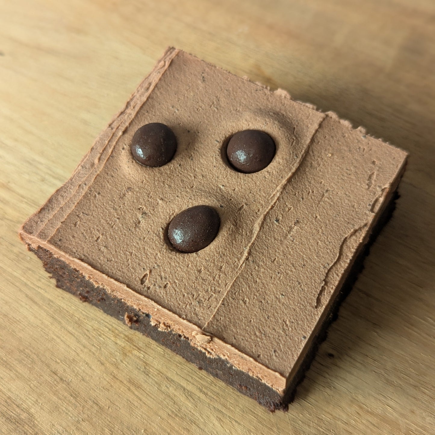 Mocha Buttercream topping with chocolate covered coffee beans