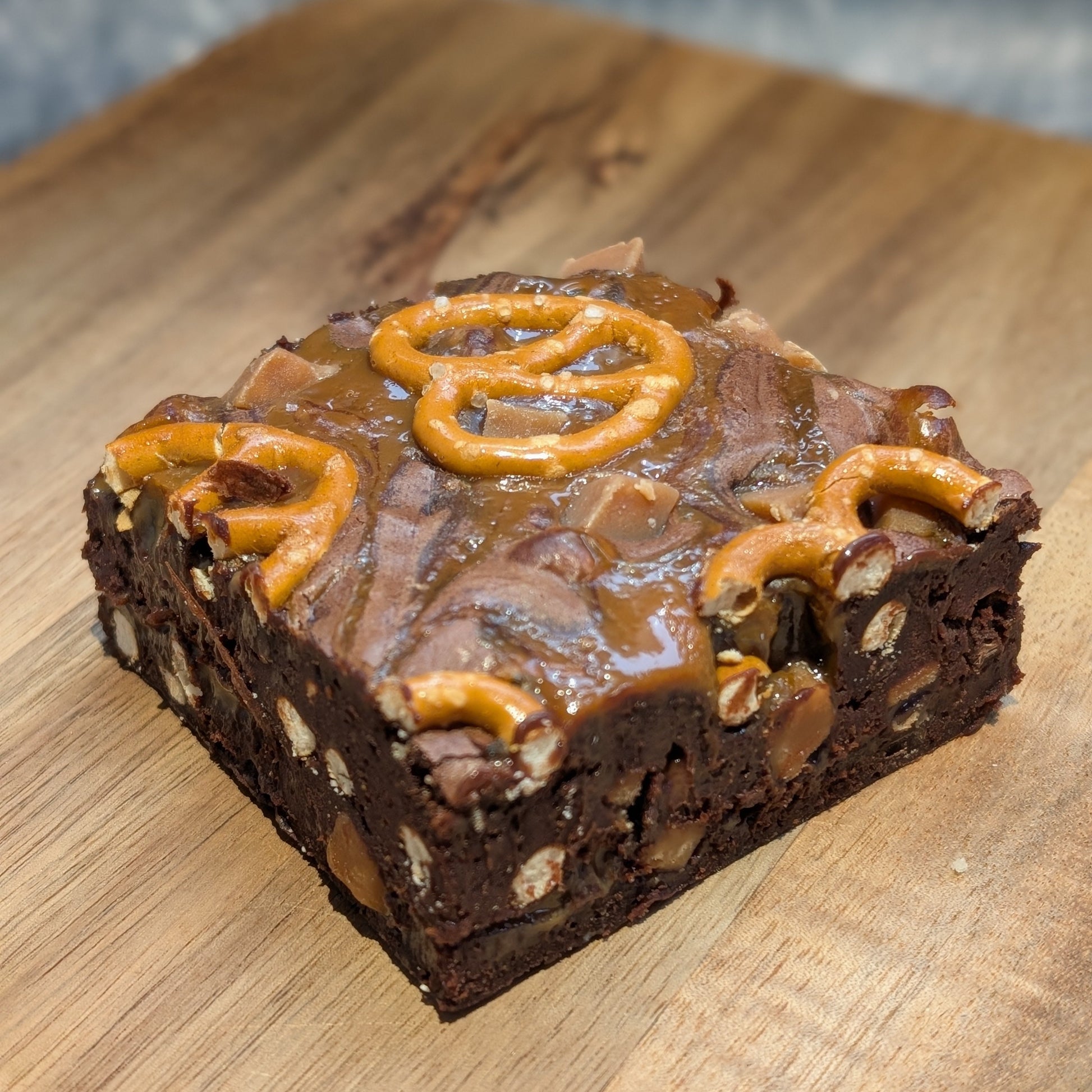 Chocolate brownie with pretzel pieces, fudge chunks and caramel.