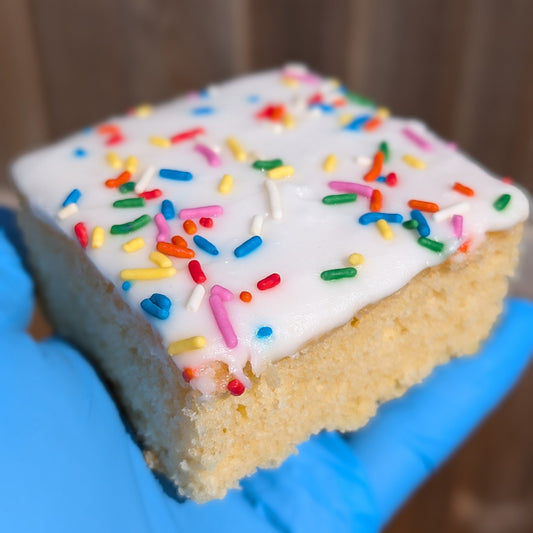 Vanilla sponge with icing and sprinkles