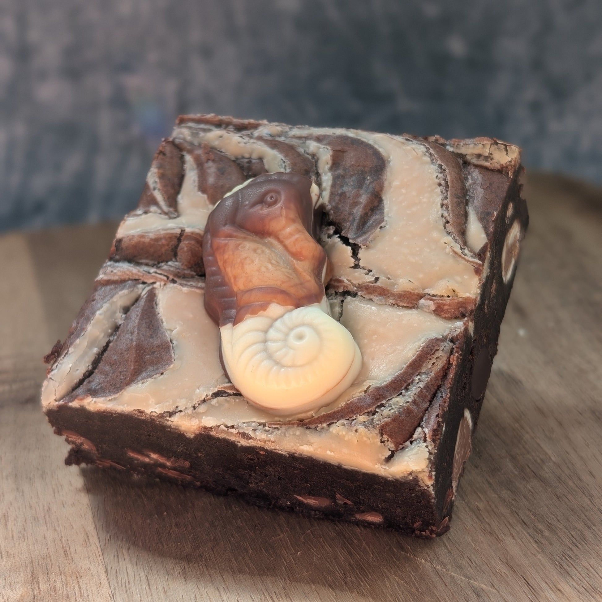 dark chocolate brownie with praline chocolate chunks and a hazelnut spread topping.